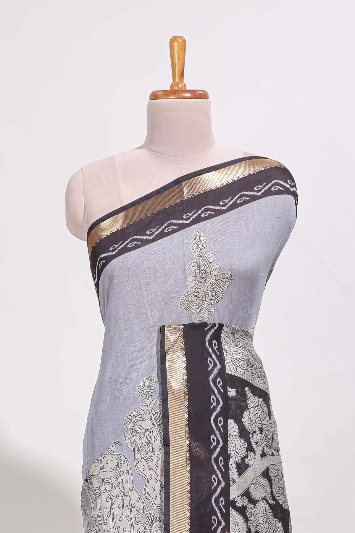 Indigo Blue colour viscose georgette saree All-over elegant ethnic detailing gold zari border and Statement pallu with artistic motifs with contrast printed blouse