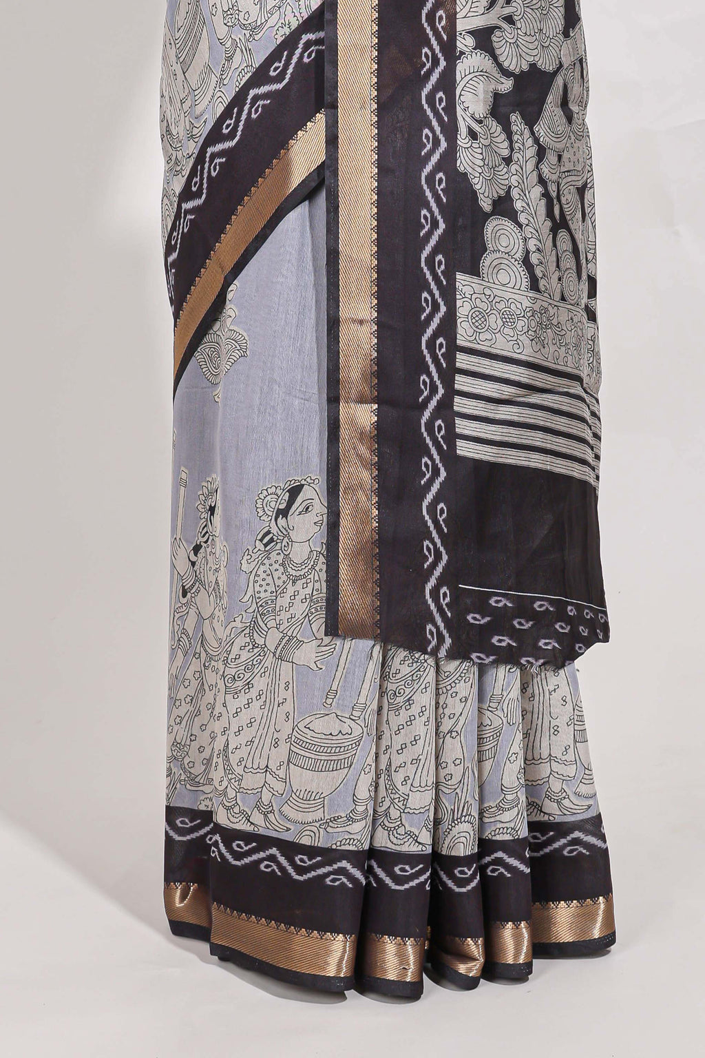 Indigo Blue colour viscose georgette saree All-over elegant ethnic detailing gold zari border and Statement pallu with artistic motifs with contrast printed blouse