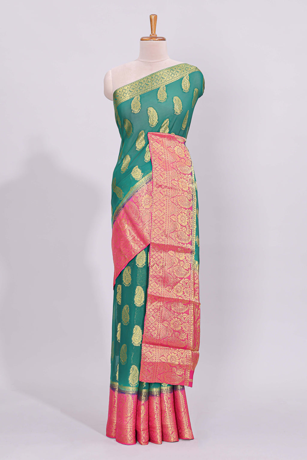 Green zari motifs viscose georgette saree with contrast zari border and blouse