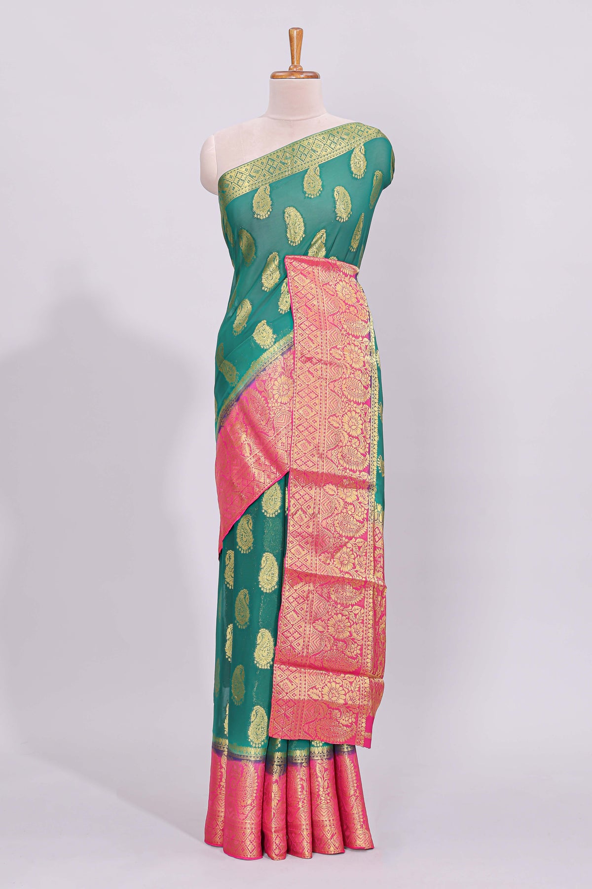 Green zari motifs viscose georgette saree with contrast zari border and blouse