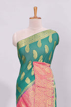 Green zari motifs viscose georgette saree with contrast zari border and blouse