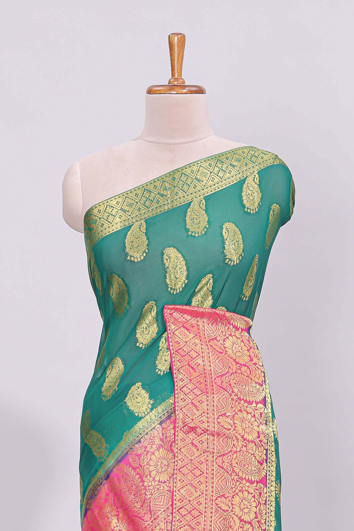 Green zari motifs viscose georgette saree with contrast zari border and blouse