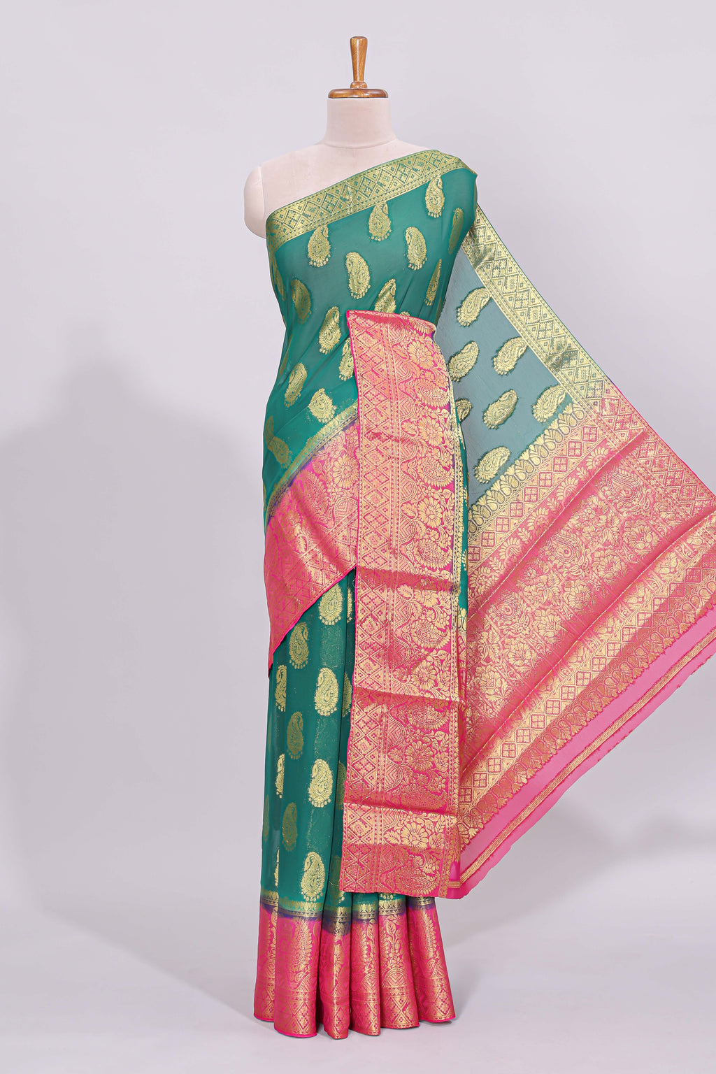 Green zari motifs viscose georgette saree with contrast zari border and blouse