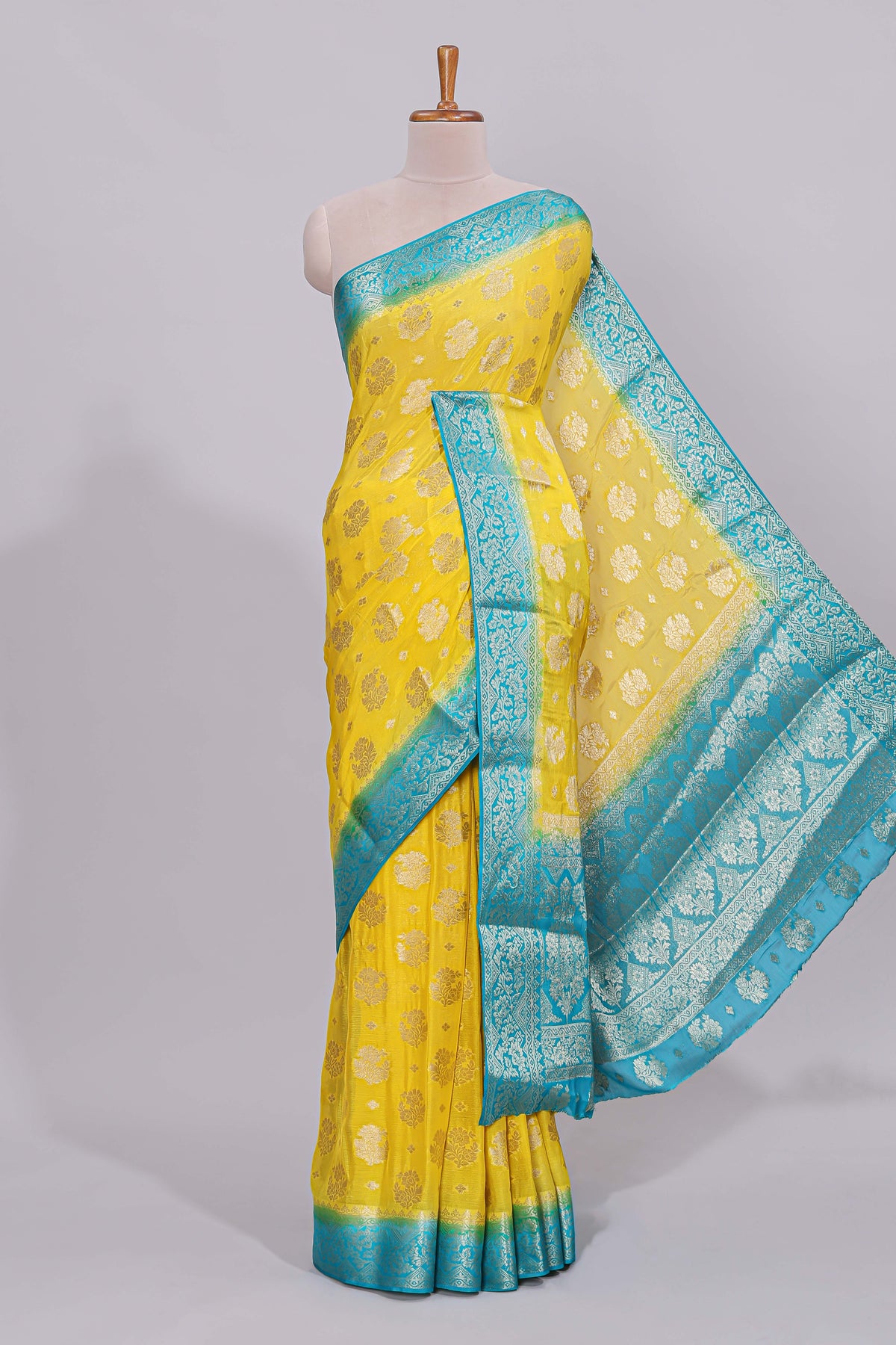 Yellow floral zari motifs viscose georgette saree with contrast zari border and blouse