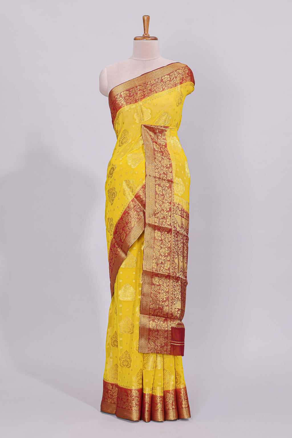 Yellow floral zari motifs viscose georgette saree with contrast checked zari border and blouse