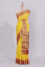 Yellow floral zari motifs viscose georgette saree with contrast checked zari border and blouse