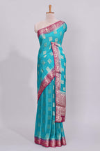 Steel blue square floral deer motifs viscose georgette saree with contrast checked zari border and blouse