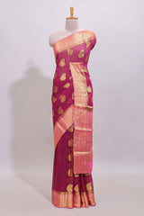 Wine pink paisley zari design viscose georgette saree with contrast zari border and blouse