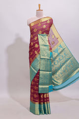 Maroon paisley zari design viscose georgette saree with contrast zari border and blouse
