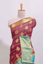 Maroon paisley zari design viscose georgette saree with contrast zari border and blouse