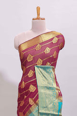Maroon paisley zari design viscose georgette saree with contrast zari border and blouse