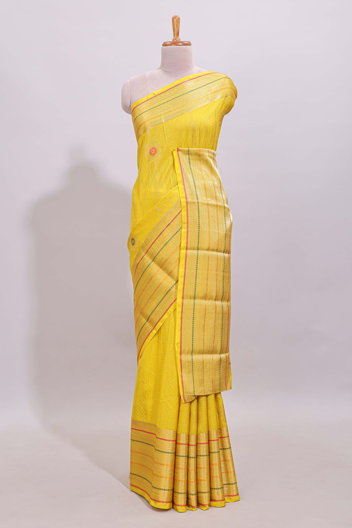 Bright yellow diagonal and vertical striped weave design viscose georgette saree with self zari border and blouse