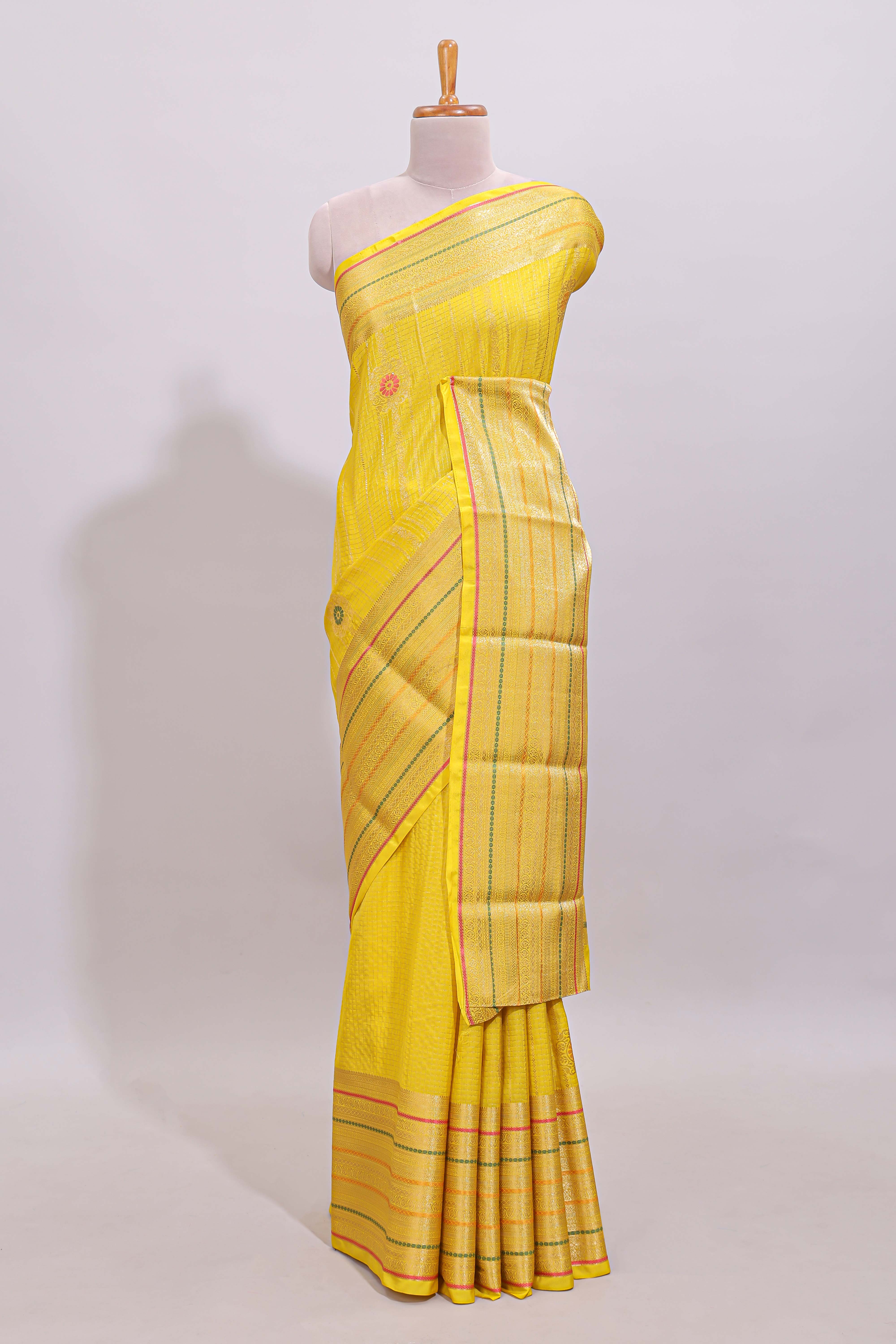 Bright yellow diagonal and vertical striped weave design viscose georgette saree with self zari border and blouse
