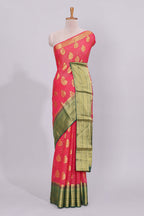 Pink striped floral motifs design viscose georgette saree with contrast checked zari border and blouse