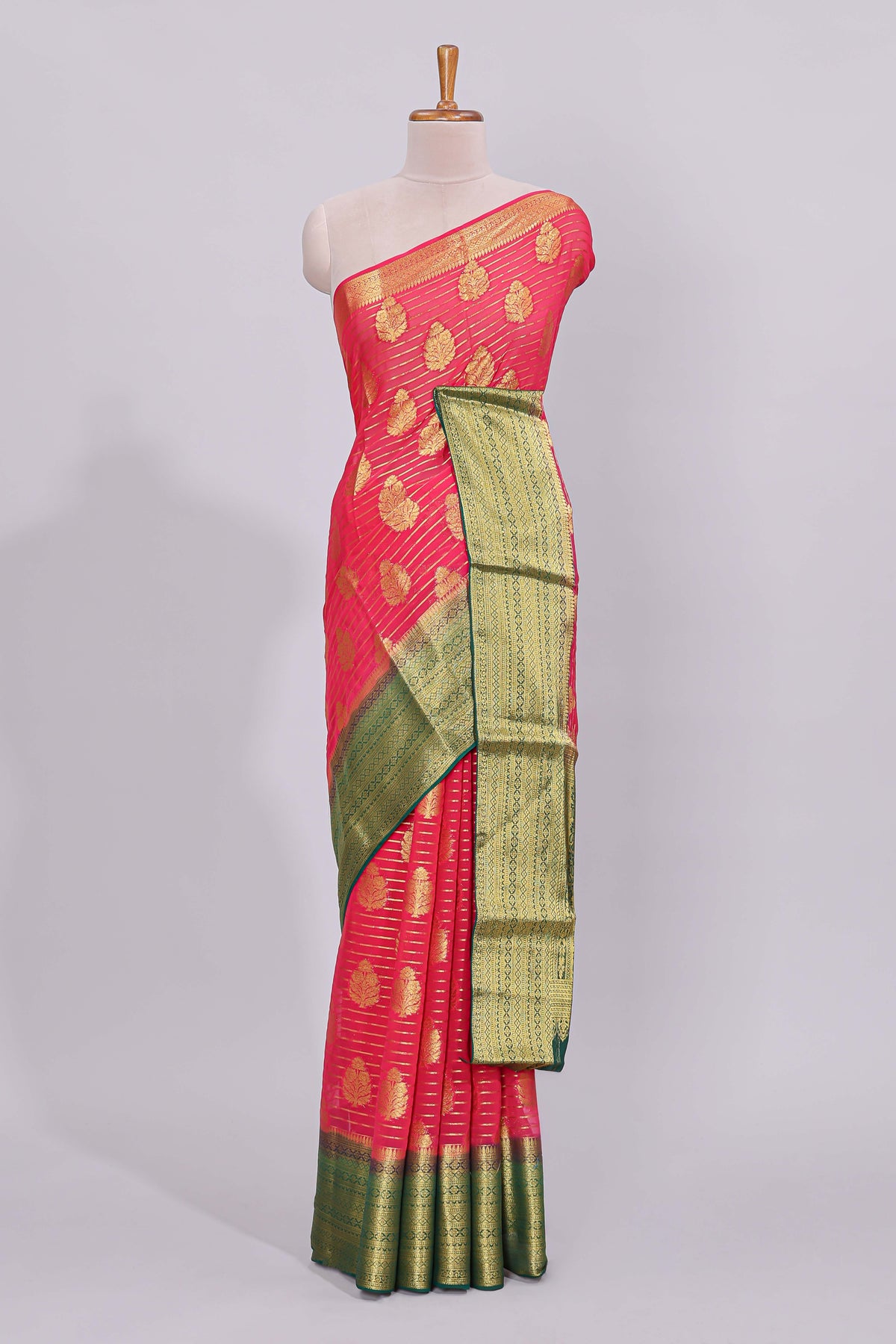Pink striped floral motifs design viscose georgette saree with contrast checked zari border and blouse