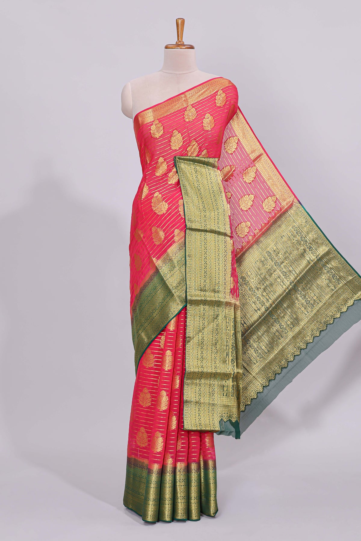Pink striped floral motifs design viscose georgette saree with contrast checked zari border and blouse