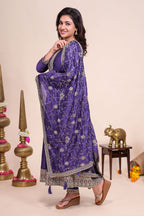Purple shade stone work Anarkali kutri with floral designed shawl and matching pant