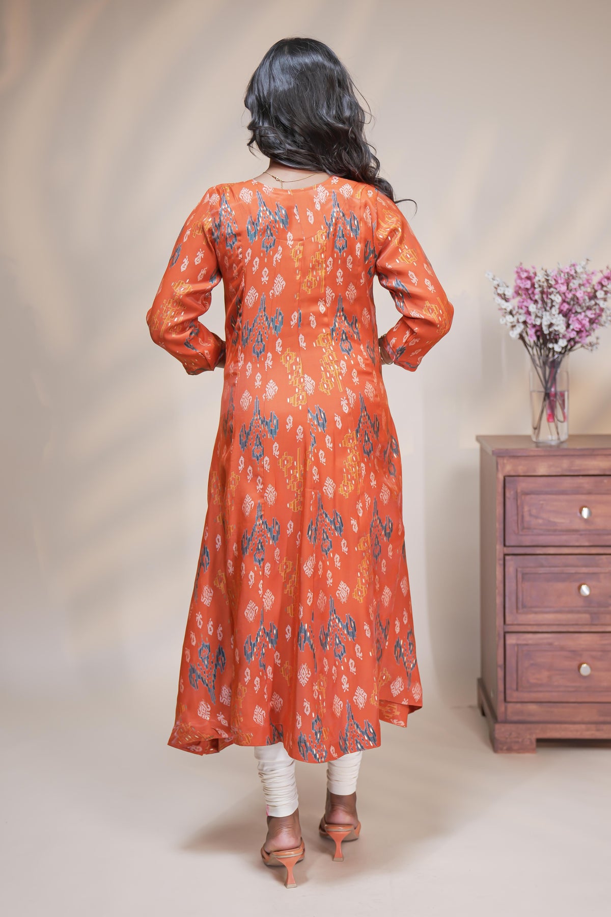 Orange straight anarkali kurti with floral design, round neck and 3/4 sleeves