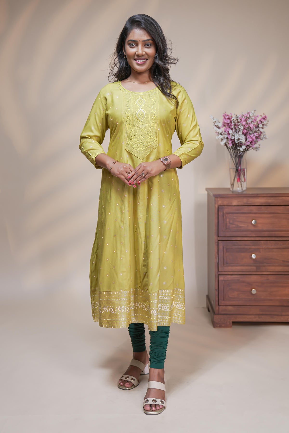 Lime green straight anarkali kurti with polka design, round neck and 3/4 sleeves