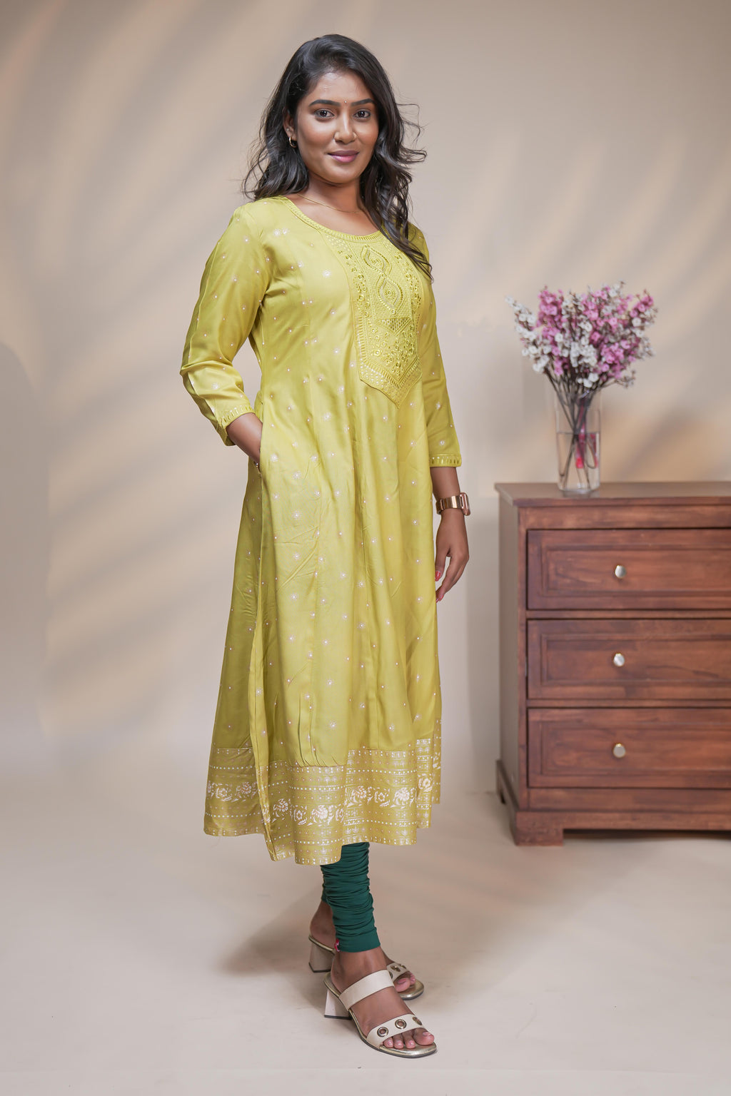 Lime green straight anarkali kurti with polka design, round neck and 3/4 sleeves