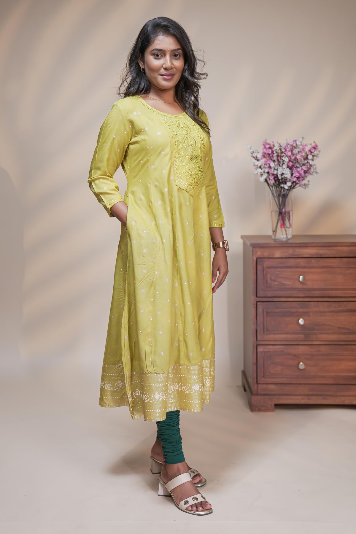 Lime green straight anarkali kurti with polka design, round neck and 3/4 sleeves