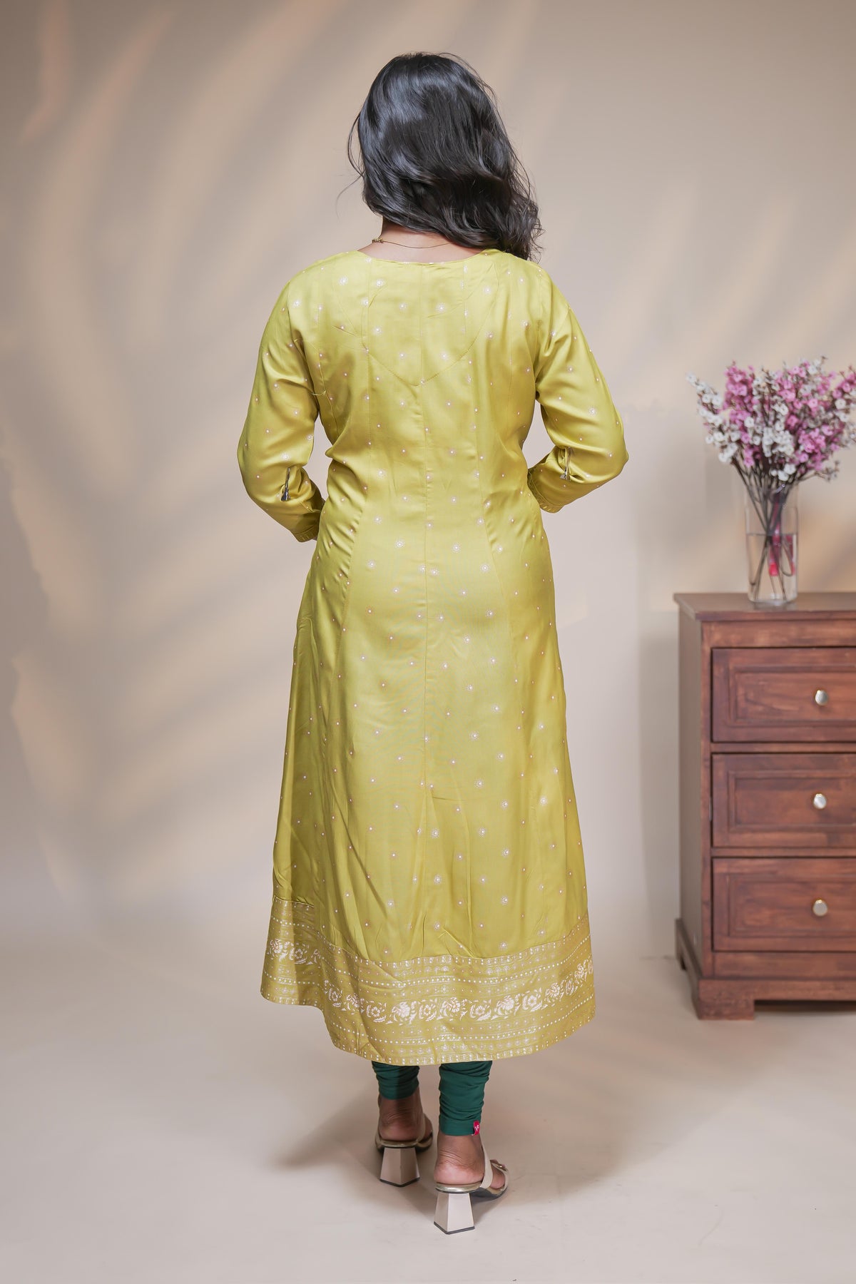 Lime green straight anarkali kurti with polka design, round neck and 3/4 sleeves