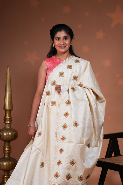 Cream embroidery floral motifs design raw silk saree with self border and matching blouse