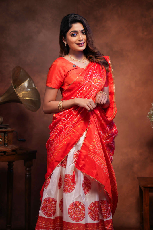 Red dola silk bhandani elephant and floral printed lehenga with contrast blouse and dhavani