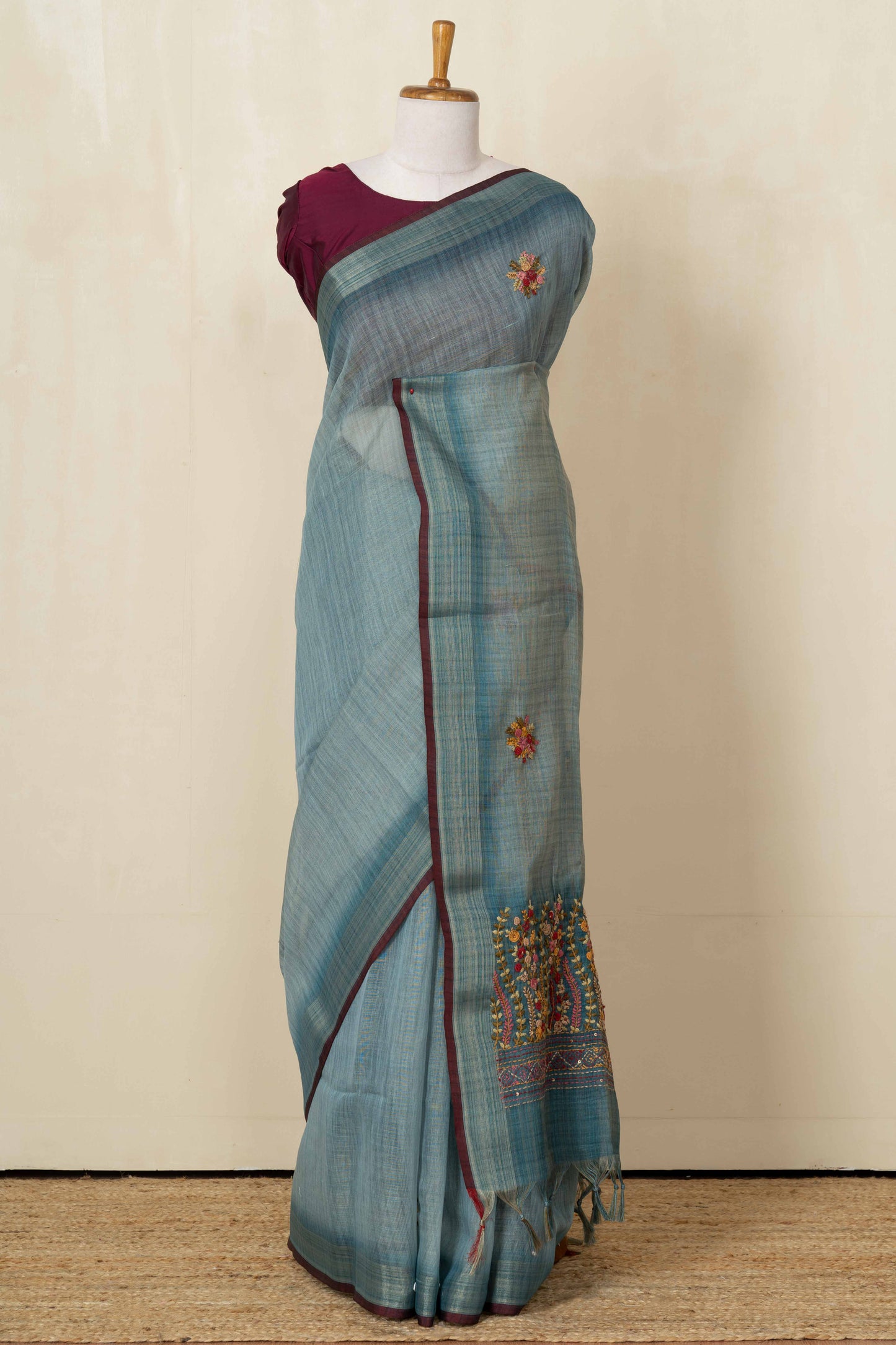 Blue linen saree with French knot work