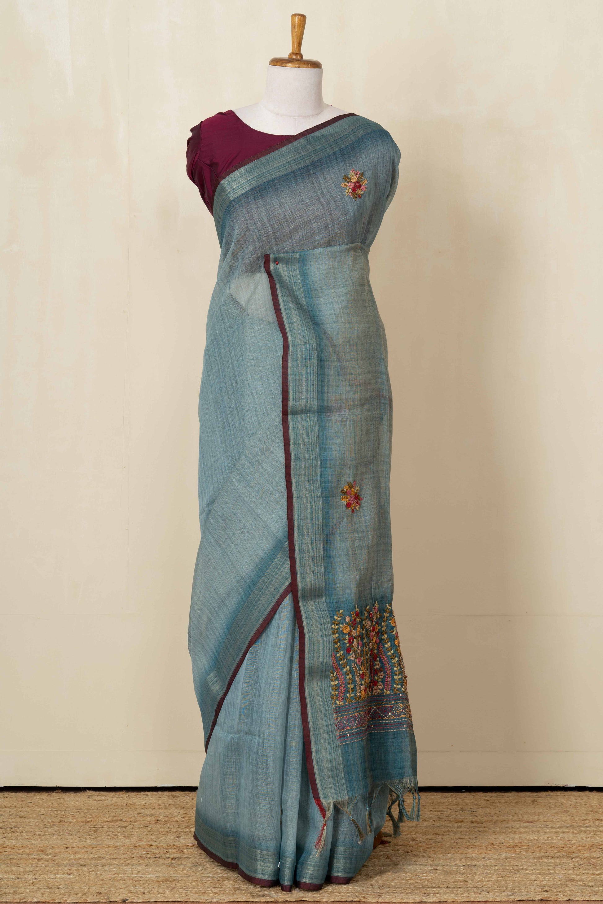 Blue linen saree with French knot work