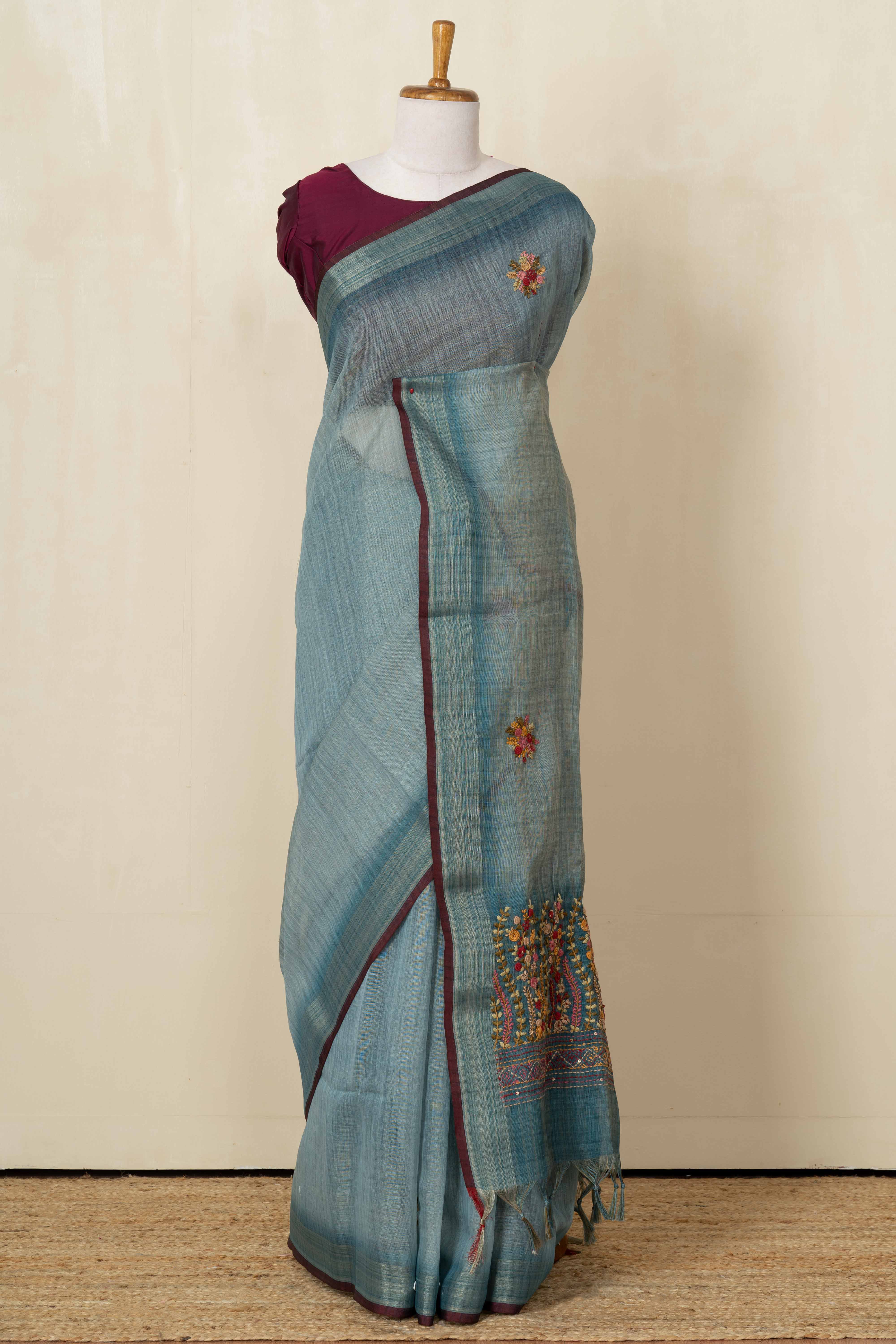 Blue linen saree with French knot work