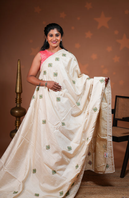 Cream embroidery floral motifs design raw silk saree with self border and matching blouse