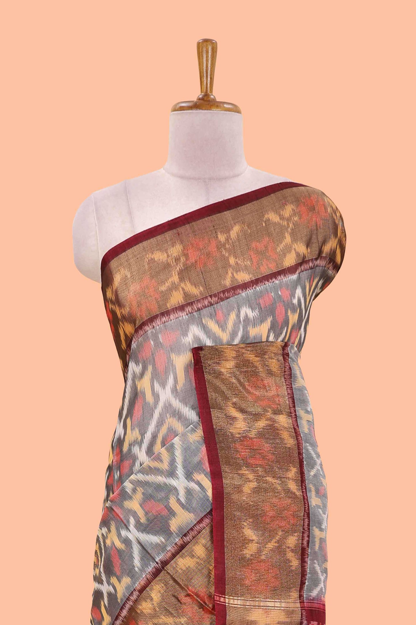 Grey ikkat cotton saree featuring traditional pochampally motifs and zari border