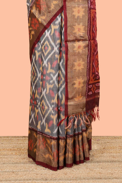 Grey ikkat cotton saree featuring traditional pochampally motifs and zari border