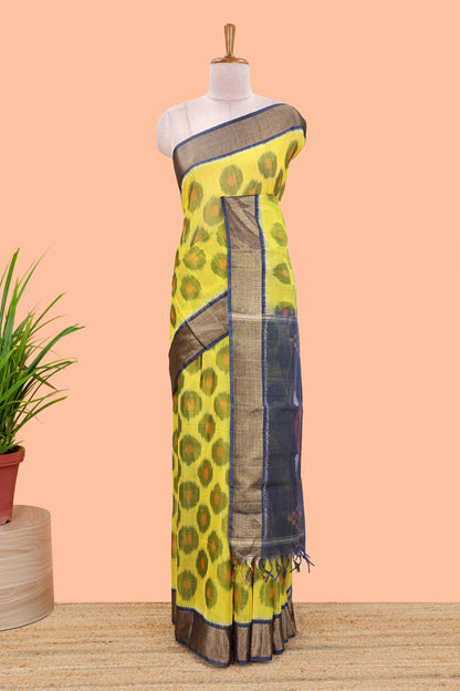 Yellow ikkat cotton saree featuring traditional pochampally motifs and zari border
