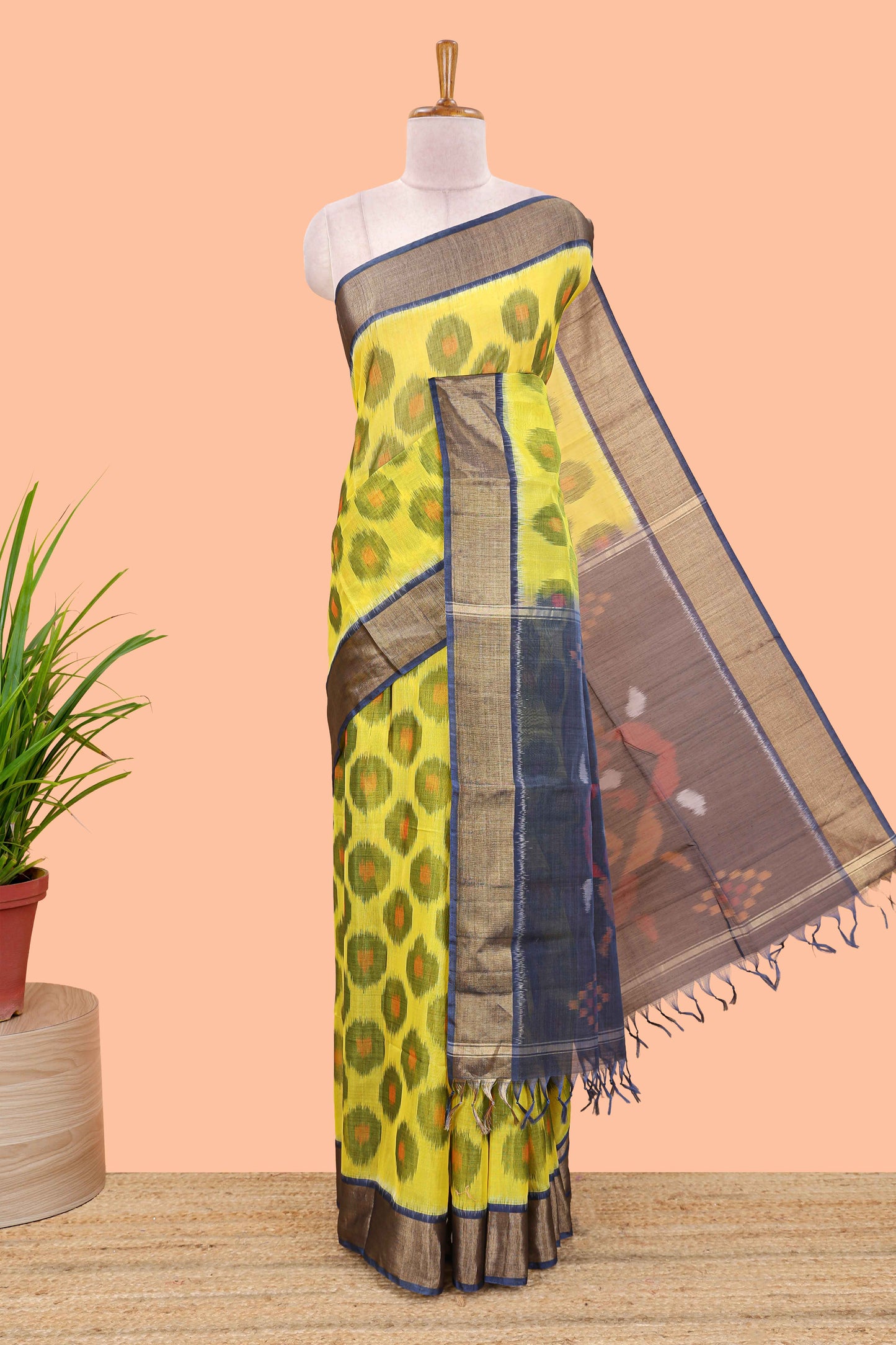 Yellow ikkat cotton saree featuring traditional pochampally motifs and zari border