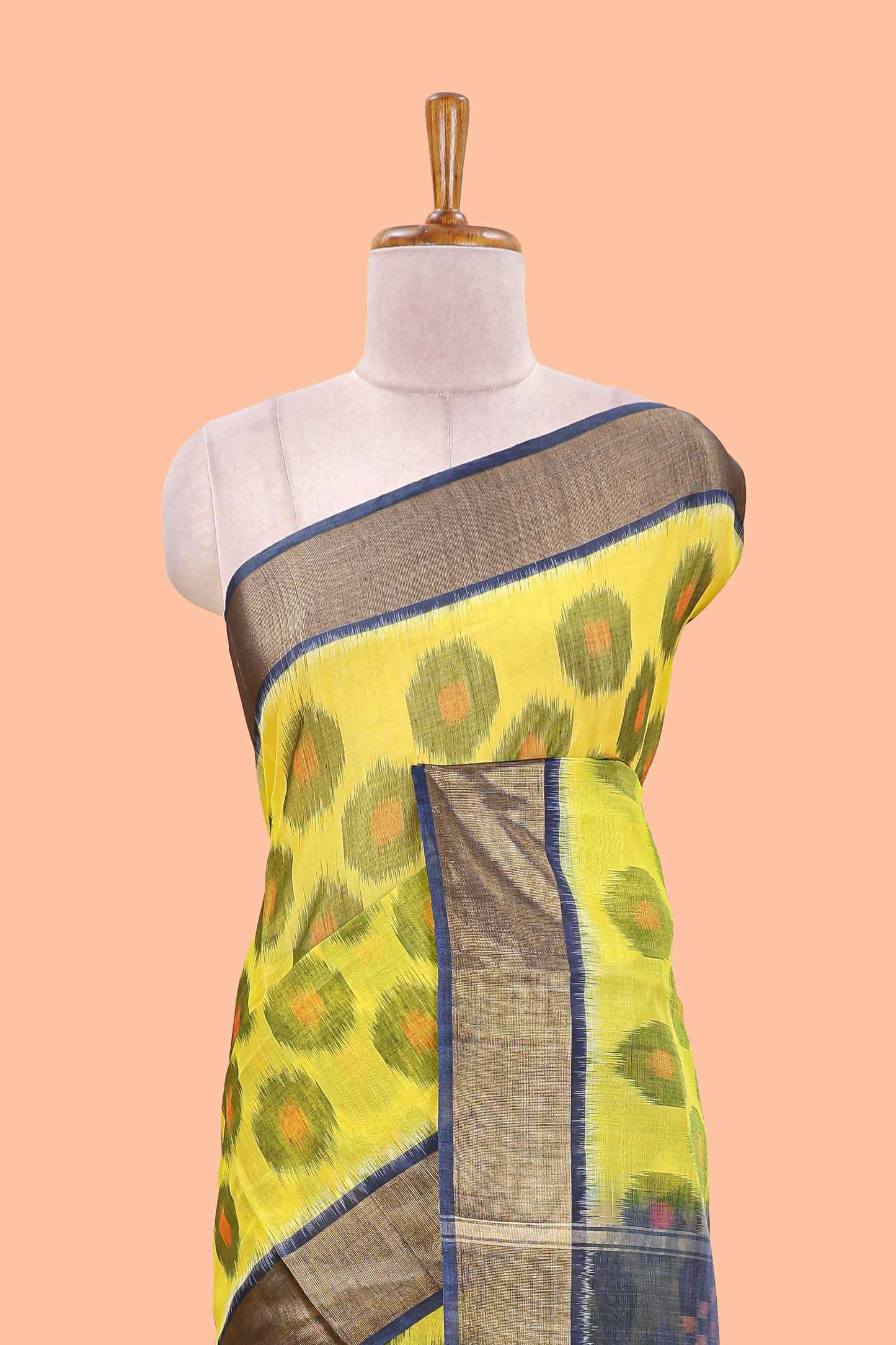 Yellow ikkat cotton saree featuring traditional pochampally motifs and zari border
