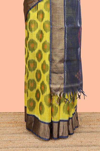 Yellow ikkat cotton saree featuring traditional pochampally motifs and zari border