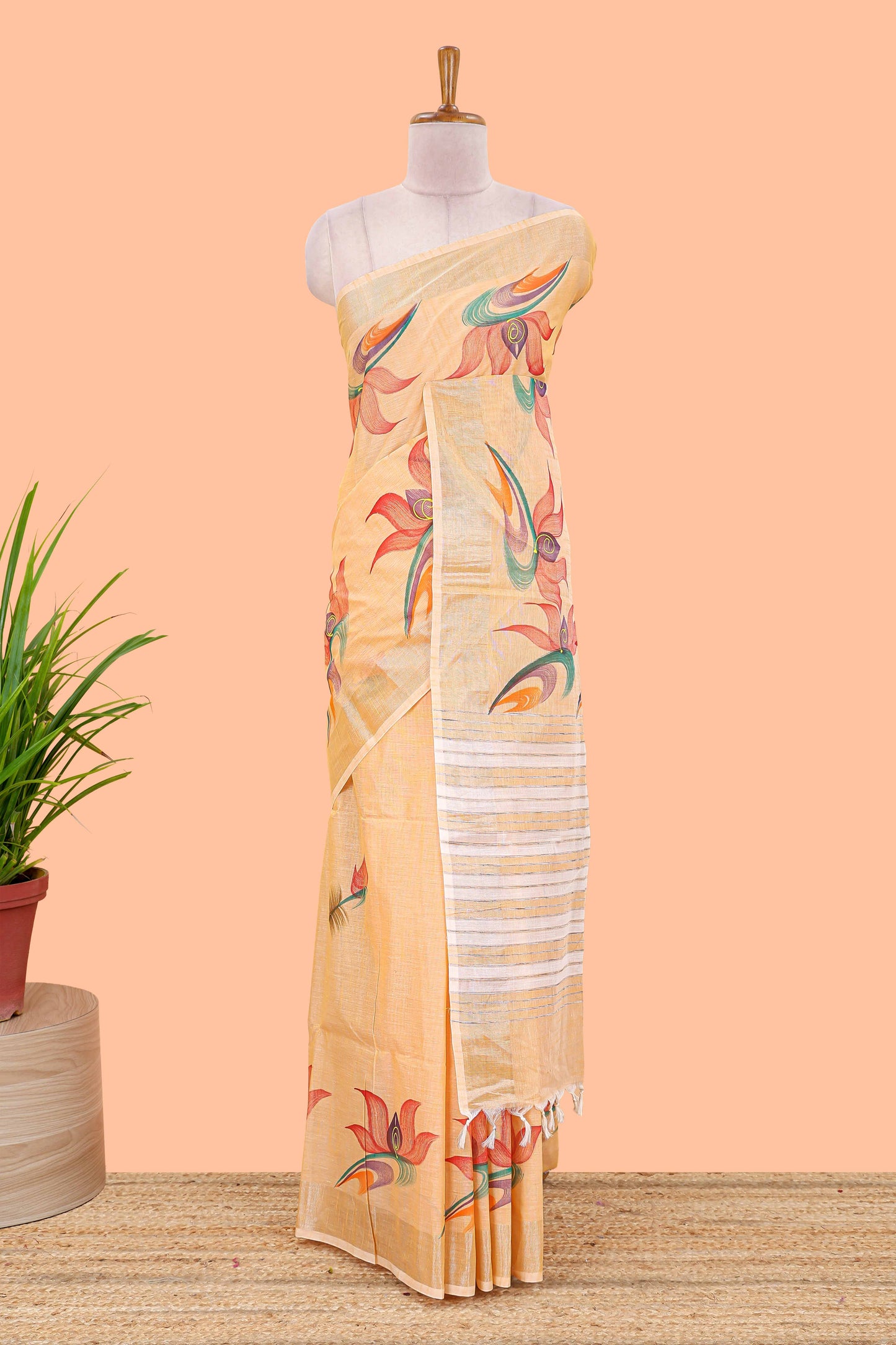 Pastel orange floral design jute cotton saree with self striped zari border and blouse