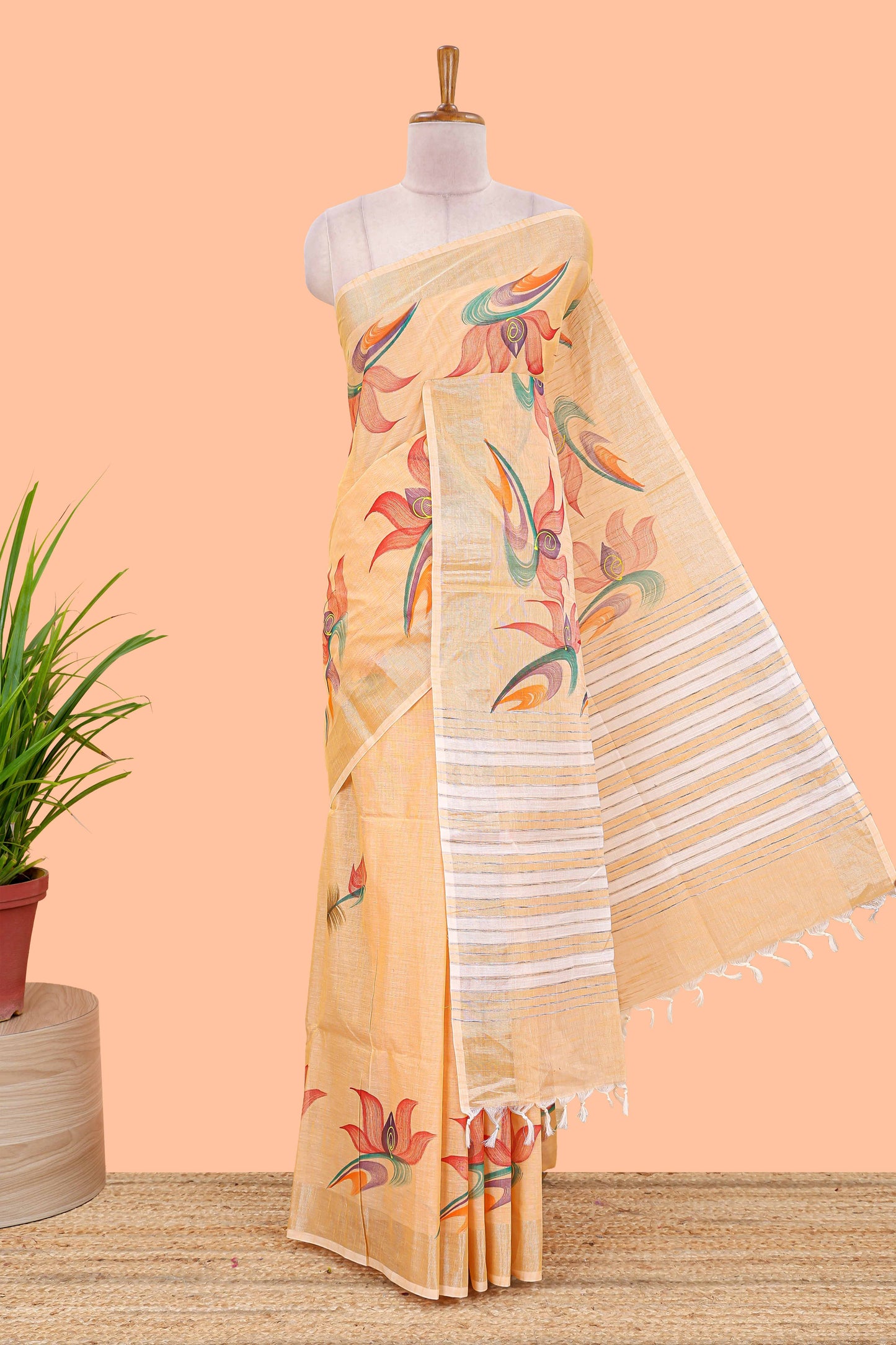 Pastel orange floral design jute cotton saree with self striped zari border and blouse