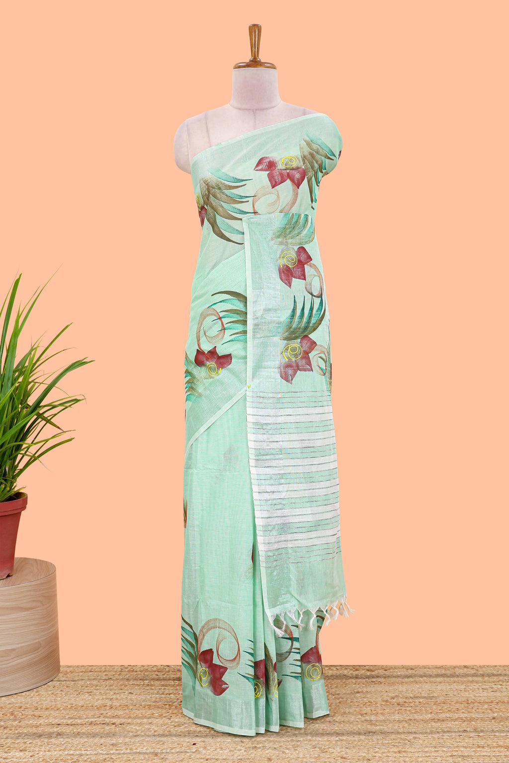 Pista green floral design jute cotton saree with self striped zari border and blouse