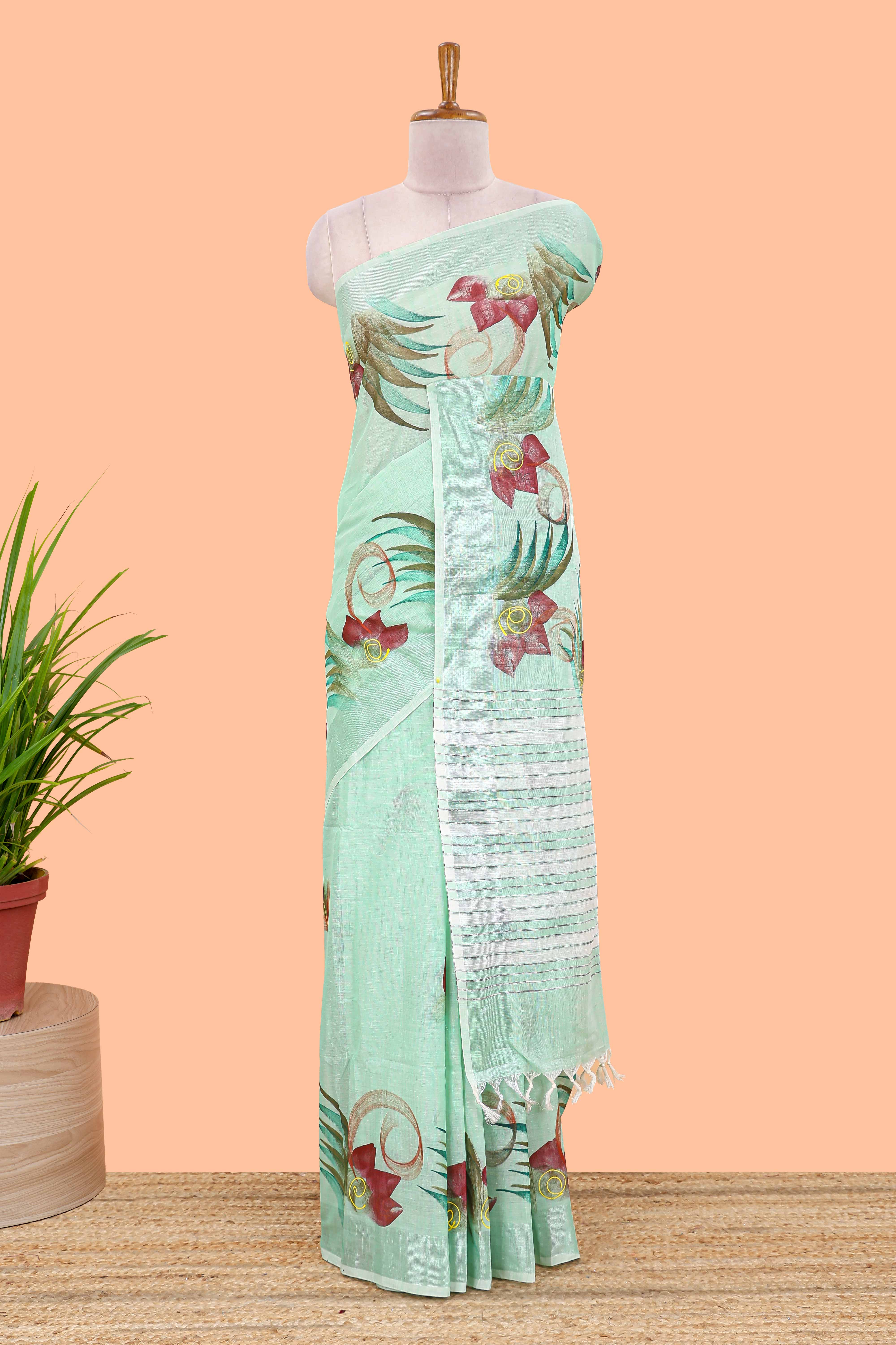 Pista green floral design jute cotton saree with self striped zari border and blouse