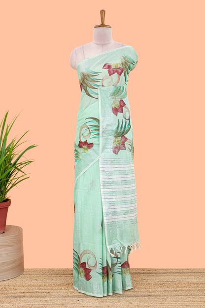 Pista green floral design jute cotton saree with self striped zari border and blouse