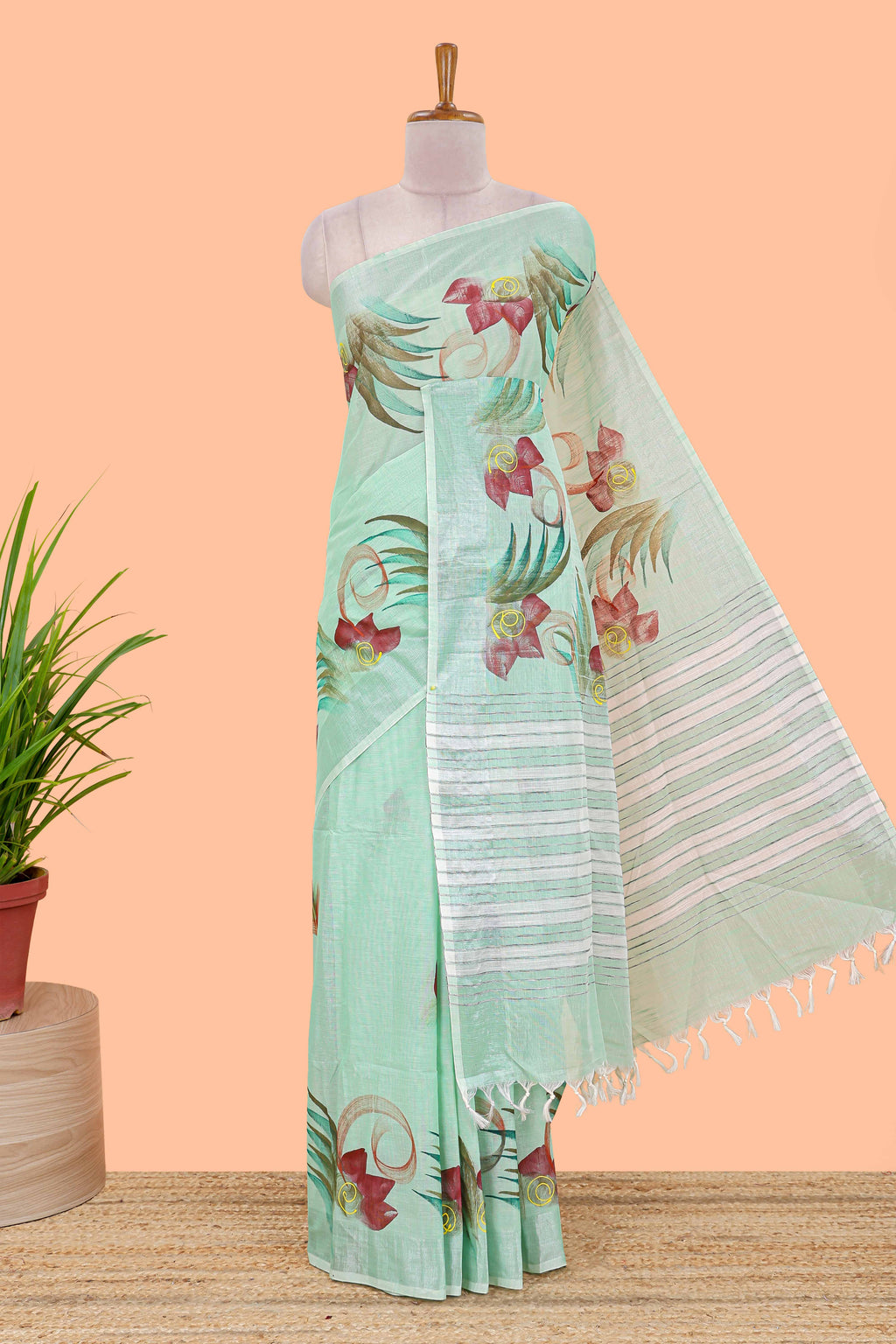 Pista green floral design jute cotton saree with self striped zari border and blouse