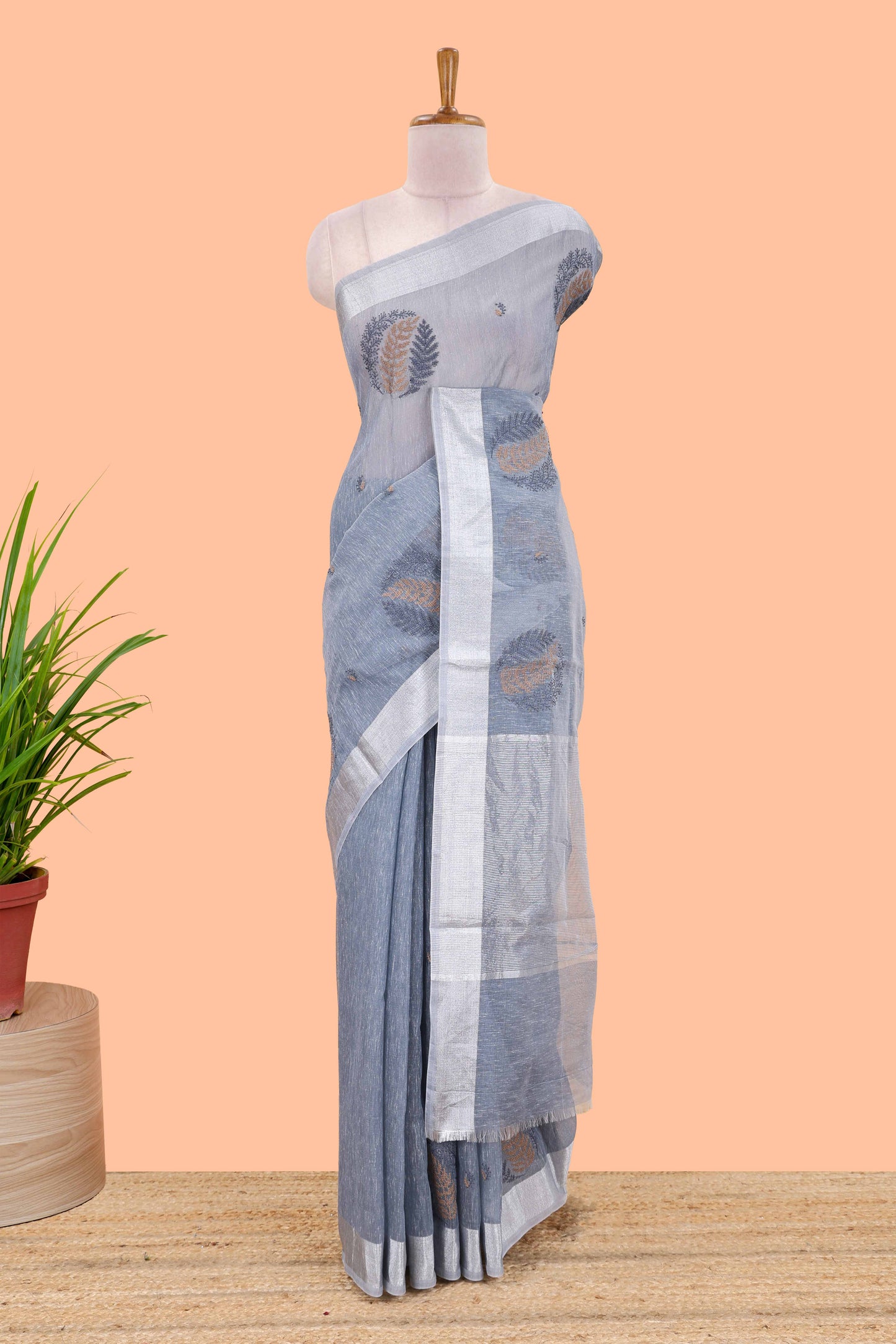 Blue jute cotton saree leaf motifs with zari border and pallu