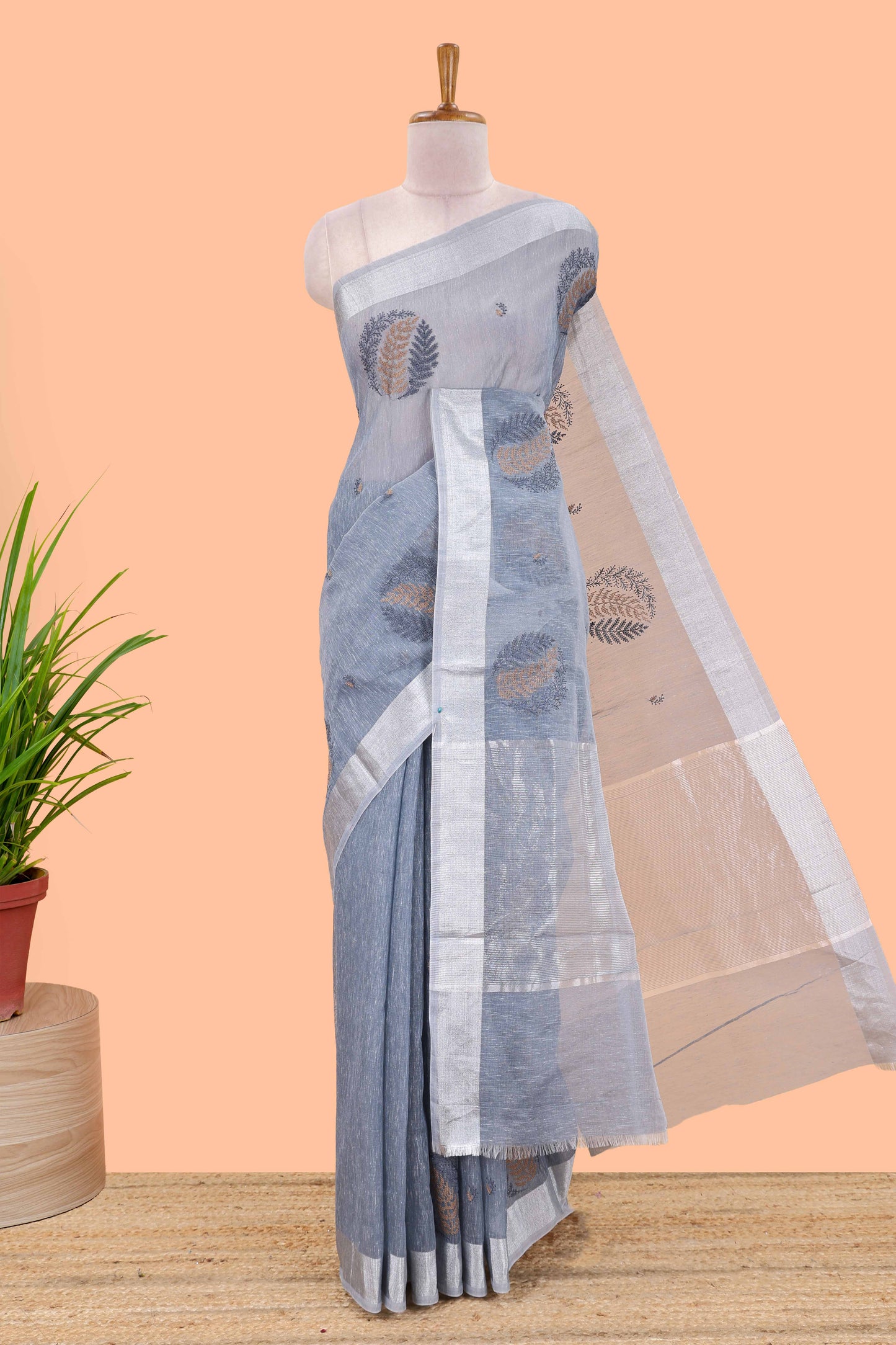 Blue jute cotton saree leaf motifs with zari border and pallu