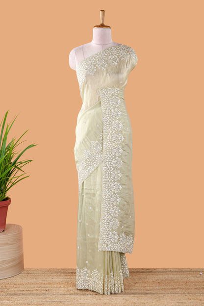 Green organza crush saree with dot motif embroidery and stone work