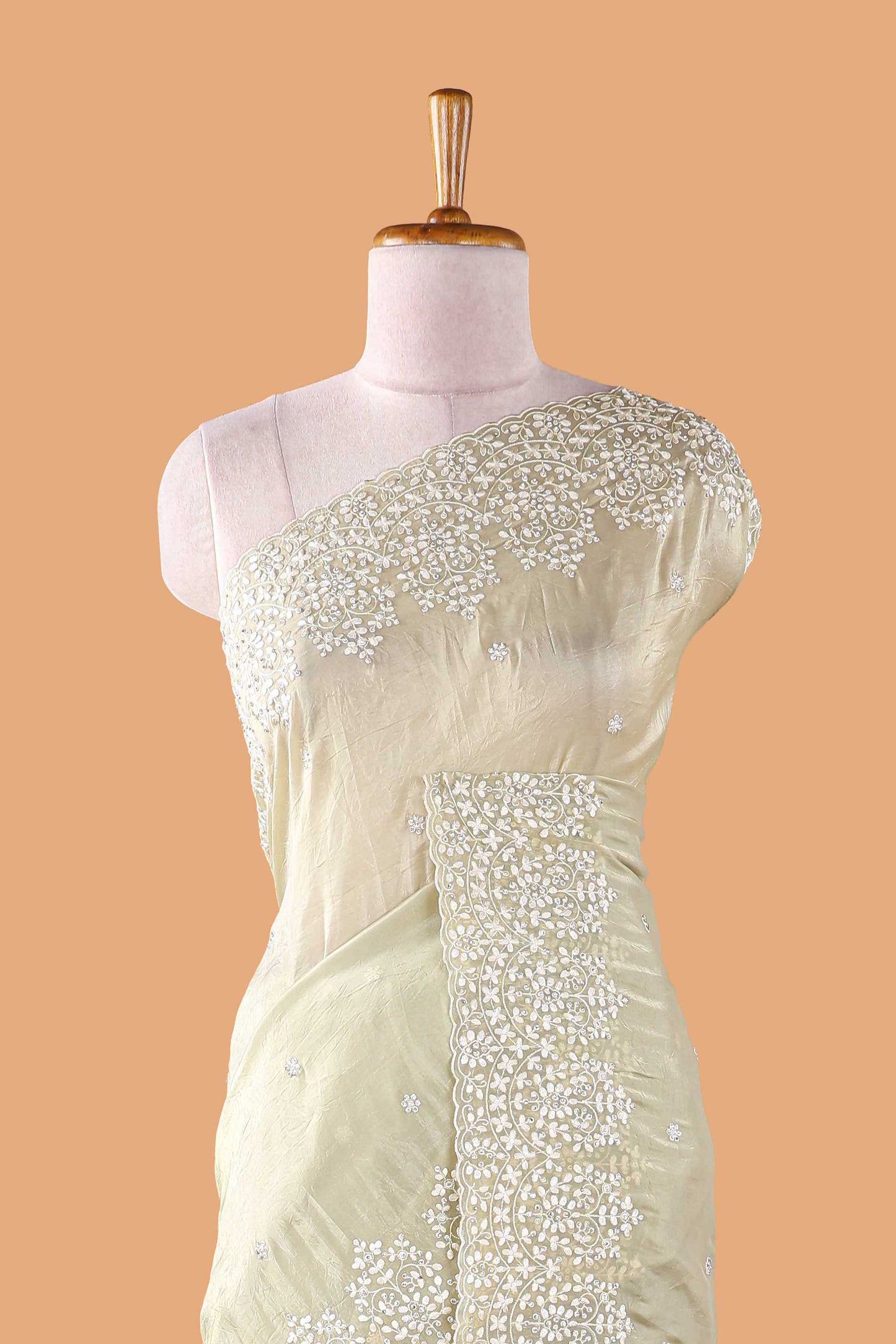 Green organza crush saree with dot motif embroidery and stone work