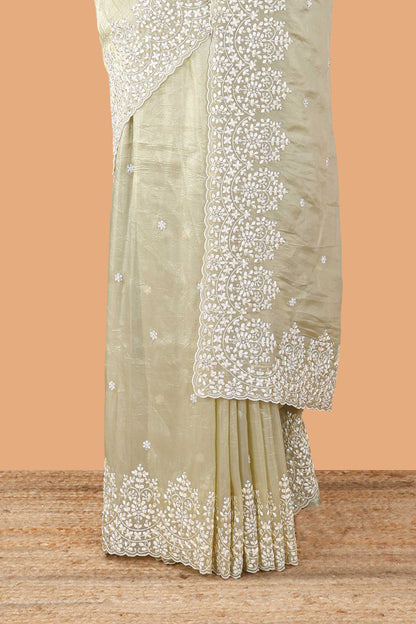 Green organza crush saree with dot motif embroidery and stone work