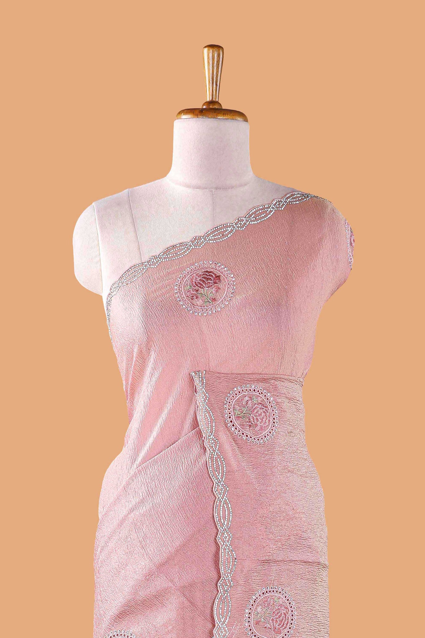 Pink organza crush saree with floral motif embroidery and stone work